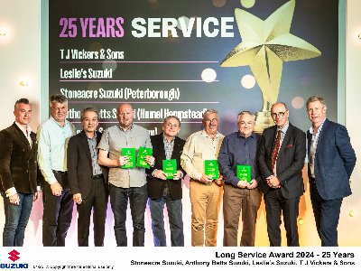 TJ Vickers celebrates 25 years Suzuki service award
