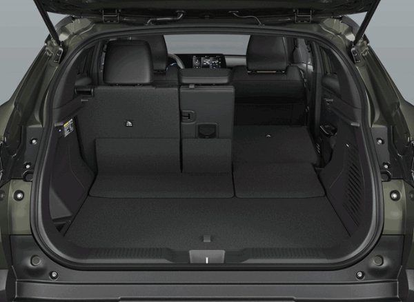 Car boot with seats folded down, showing extended cargo space.