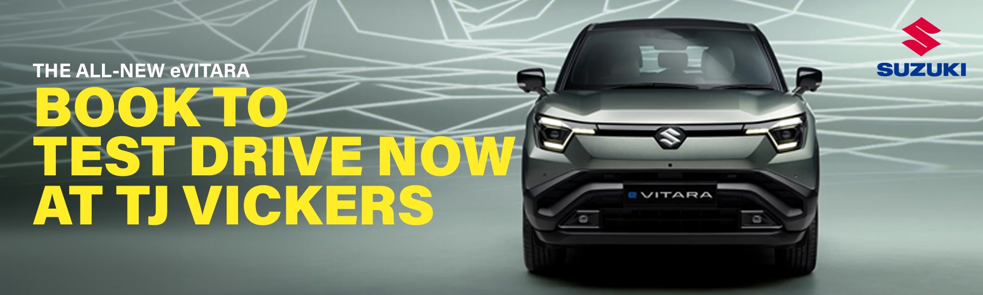 Front view of Suzuki eVitara with text promoting test drive at TJ Vickers.